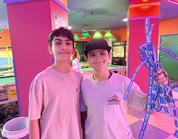 Norup 6th Grade students holding game tickets at Skate World